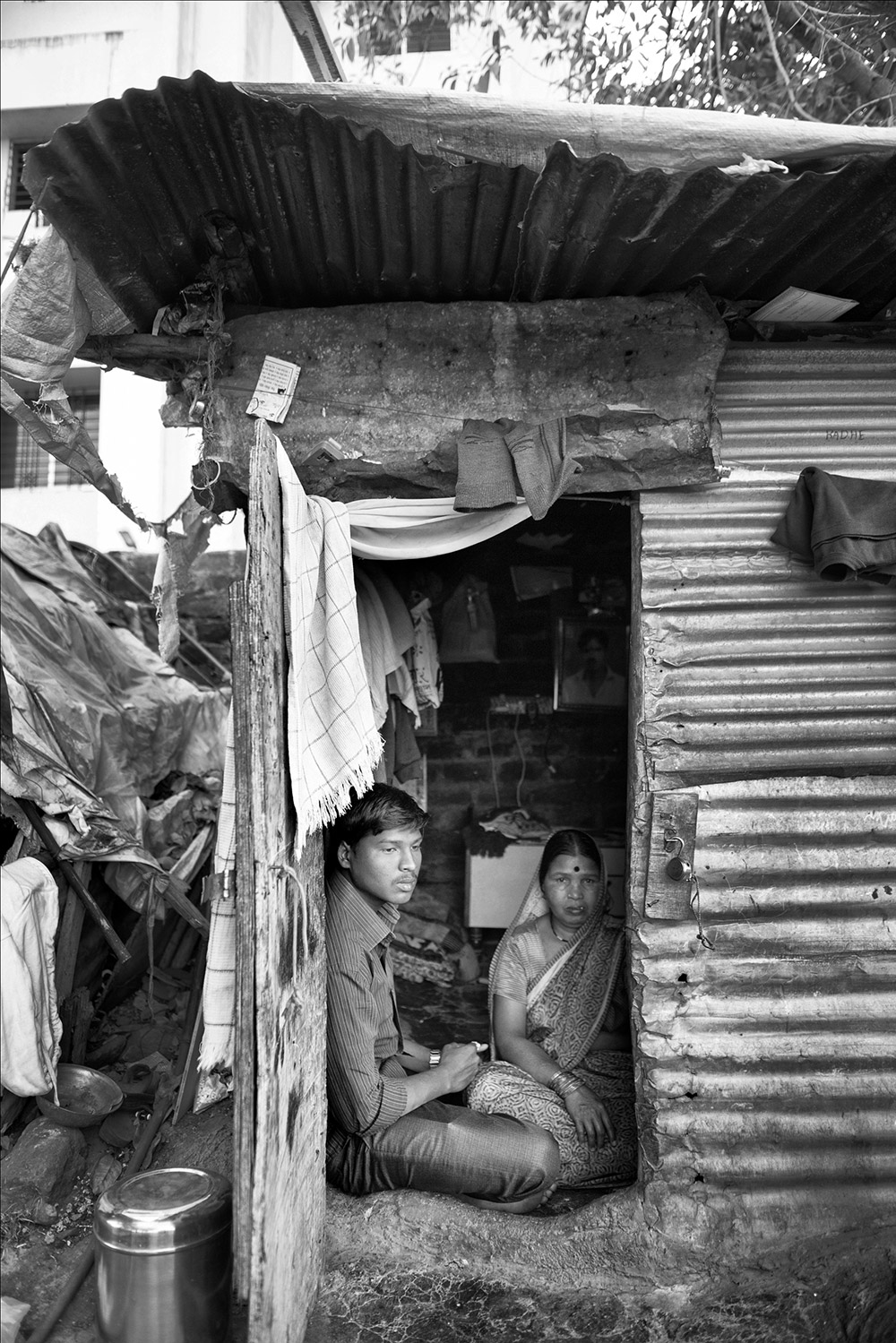 The Udage family in Pune’s Chikali area has been living under threat and 24-hour police protection ever since Manik, the 25-year-old sole bread earner of the family, was hacked to death for celebrating Dr. Babasaheb Ambedkar’s birth anniversary on April 14, 2014. In 2014, Manik, a local contractor and founder of Samvidhan Pratistha – an organisation established to promote Dalit cultural events – was brutally beaten by a steel rod and stoned to death by four men from upper caste families. He was subjected to this brutality because he decided to organise a grand event to celebrate Ambedkar jayanti in Morya Vasti where upper caste communities are dominant. The trial is pending in Pune Sessions court. The Udage family in Pune’s Chikali area has been living under threat and 24-hour police protection ever since Manik, the 25-year-old sole bread earner of the family, was hacked to death for celebrating Dr. Babasaheb Ambedkar’s birth anniversary on April 14, 2014. In 2014, Manik, a local contractor and founder of Samvidhan Pratistha – an organisation established to promote Dalit cultural events – was brutally beaten by a steel rod and stoned to death by four men from upper caste families. He was subjected to this brutality because he decided to organise a grand event to celebrate Ambedkar jayanti in Morya Vasti where upper caste communities are dominant. The trial is pending in Pune Sessions court.