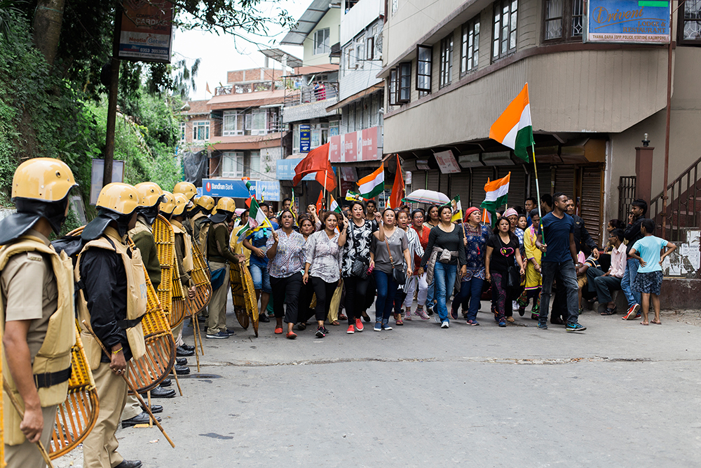 West Bengal Police stand guard during a rally led by women in Kalimpong on June 17. Photo: Praveen Chettri West Bengal Police stand guard during a rally led by women in Kalimpong on June 17. Photo: Praveen Chettri