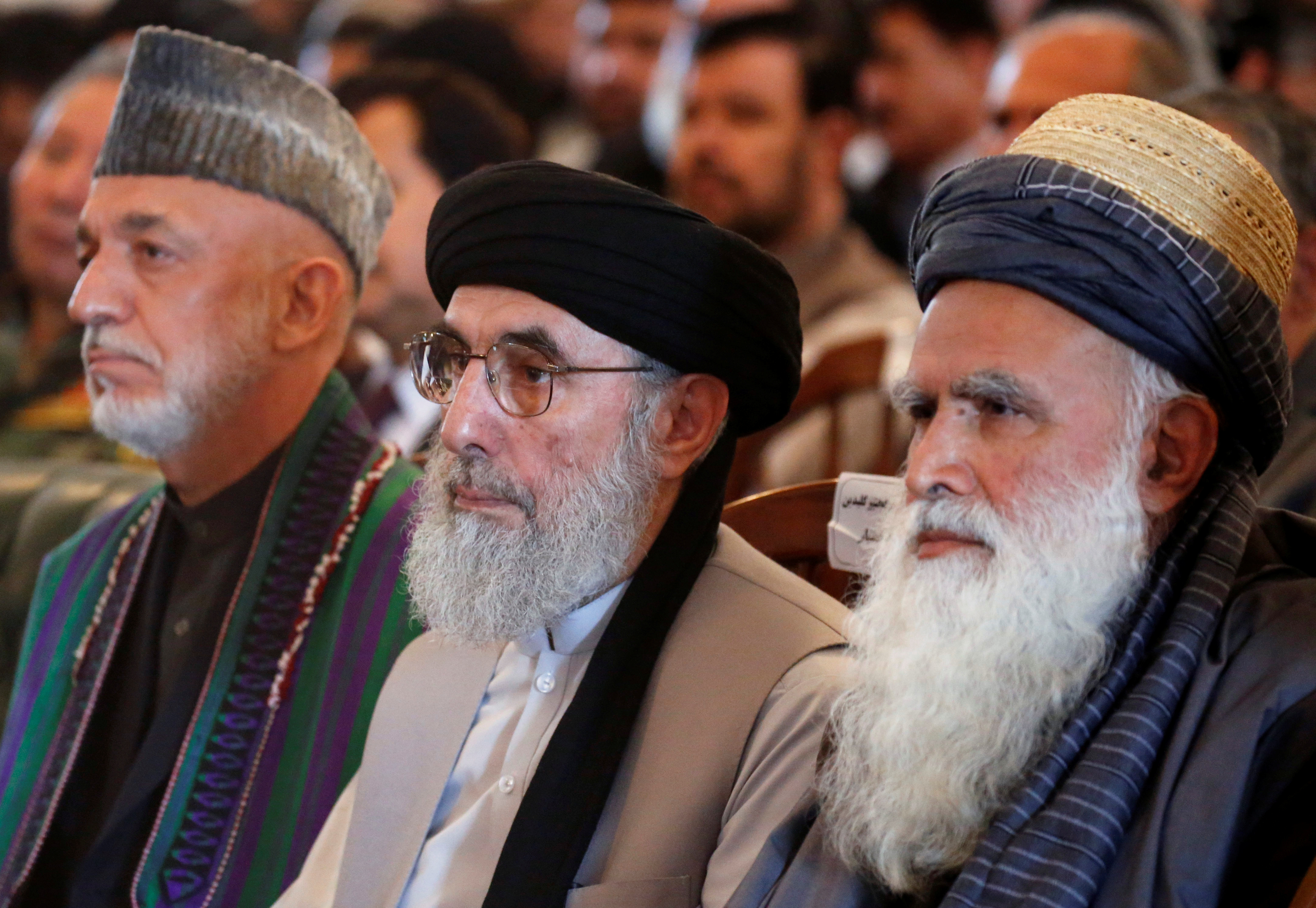 Gulbuddin Hekmatyar (centre), with former Afghan President Hamid Karzai (left), at a welcoming ceremony at the presidential palace in Kabul on May 4. (Credit: Omar Sobhani / Reuters) Gulbuddin Hekmatyar (centre), with former Afghan President Hamid Karzai (left), at a welcoming ceremony at the presidential palace in Kabul on May 4. (Credit: Omar Sobhani / Reuters)