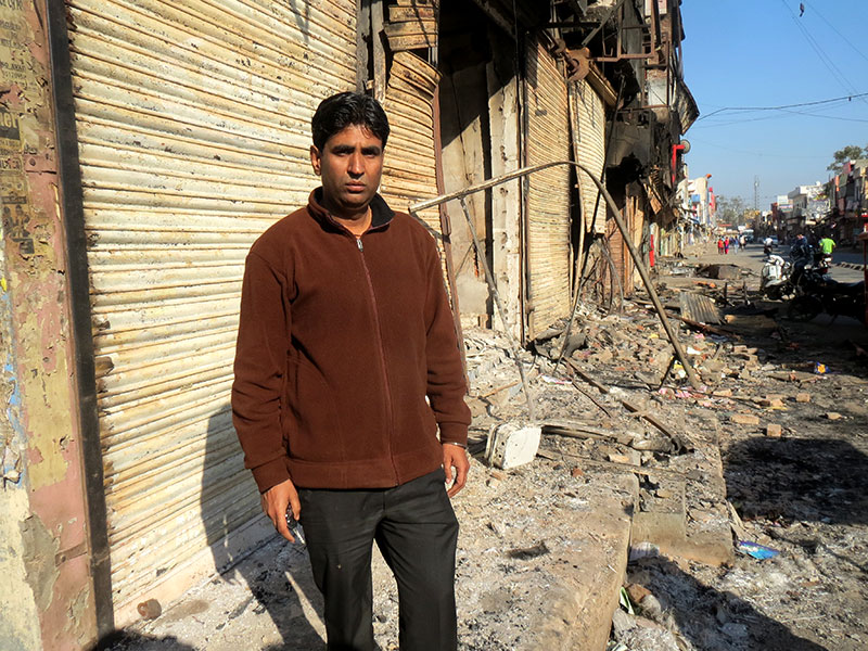 In Jhajjar, Jat protestors set fire to shops owned by Punjabi and Saini businessman. Mukesh Kumar Punjabi owned a grocery store. In Jhajjar, Jat protestors set fire to shops owned by Punjabi and Saini businessman. Mukesh Kumar Punjabi owned a grocery store.