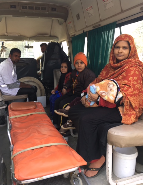 Khurshida, 30, takes the ambulance home after getting treatment for her one-month-old son who was finding it difficult to breathe. Her children were in for a joy ride. (Photo credit: Menaka Rao). Khurshida, 30, takes the ambulance home after getting treatment for her one-month-old son who was finding it difficult to breathe. Her children were in for a joy ride. (Photo credit: Menaka Rao).