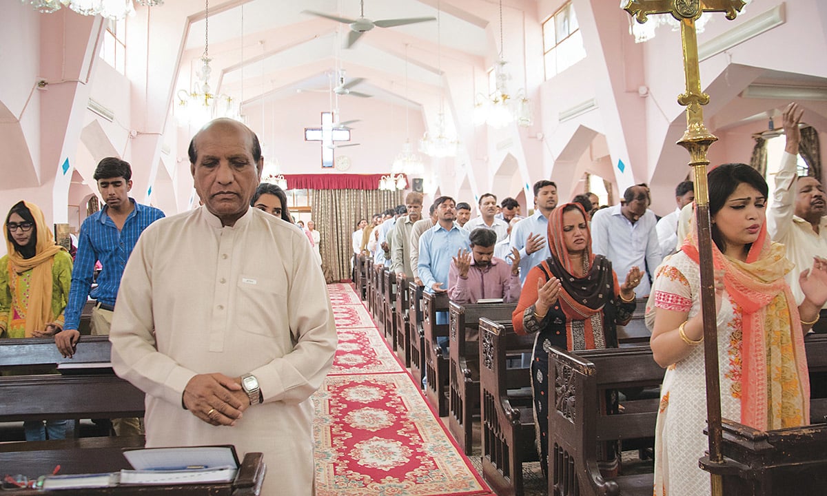 William Barkat (front left) offers prayers at St. Mary’s Church | Sara Faruqi William Barkat (front left) offers prayers at St. Mary’s Church | Sara Faruqi