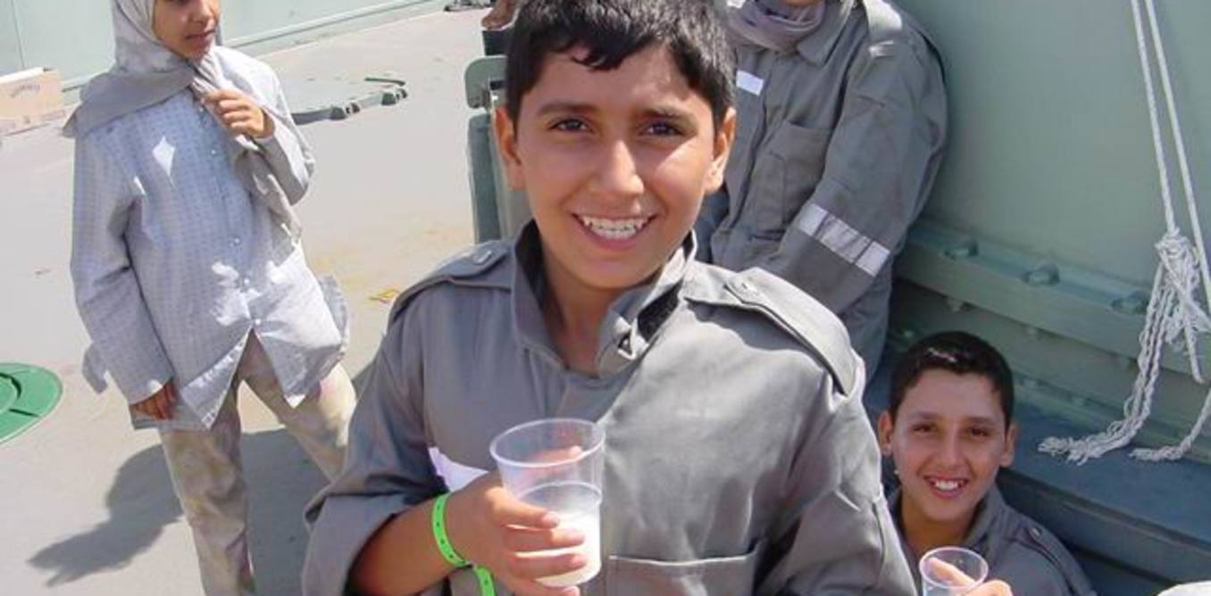 Photos of beaming young asylum-seekers with their families aboard HMAS Adelaide in October 2001 told a completely different story to the government’s spurious ‘children overboard’ claims. Courtesy Project SafeCom, Jack H Smit. Photos of beaming young asylum-seekers with their families aboard HMAS Adelaide in October 2001 told a completely different story to the government’s spurious ‘children overboard’ claims. Courtesy Project SafeCom, Jack H Smit.