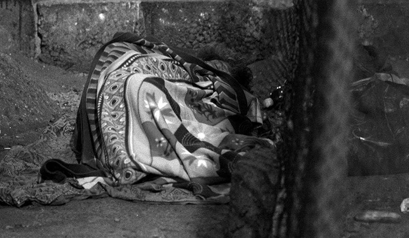 Under the garb of Swachh Bharat and Swachh Mumbai Abhiyaan, the homeless living underneath flyovers in Matunga were forcibly evicted. Now, their erstwhile homes are fenced and guarded. Here, a homeless man sleeps next to the fence. Under the garb of Swachh Bharat and Swachh Mumbai Abhiyaan, the homeless living underneath flyovers in Matunga were forcibly evicted. Now, their erstwhile homes are fenced and guarded. Here, a homeless man sleeps next to the fence.