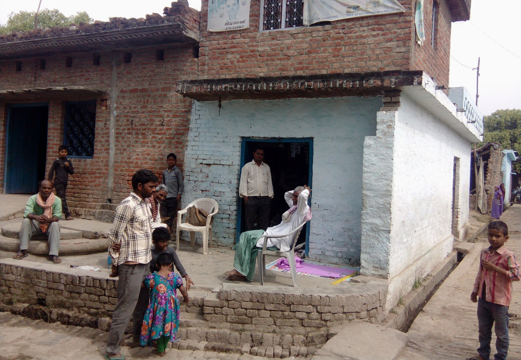 Residents gather near the village well Residents gather near the village well
