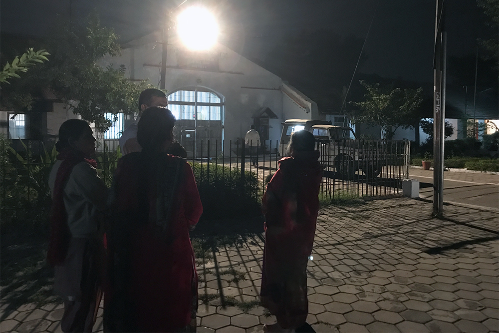 Friends and neighbours wait for Anita Francis and Amrit Kumar Mathera to be released from Indore district jail on Friday night. Friends and neighbours wait for Anita Francis and Amrit Kumar Mathera to be released from Indore district jail on Friday night.