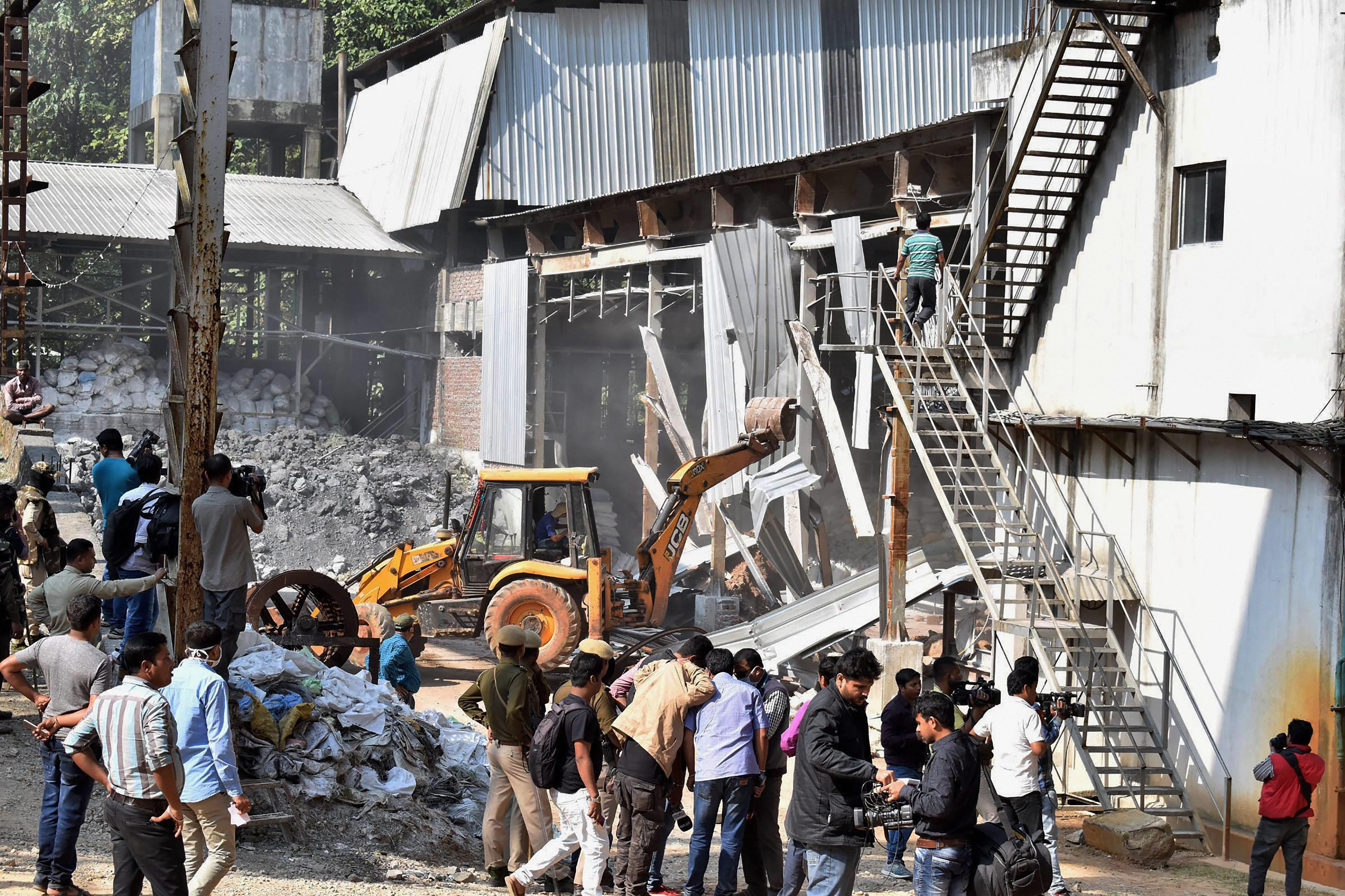 Eviction drive underway. (Photo credit: PTI). Eviction drive underway. (Photo credit: PTI).