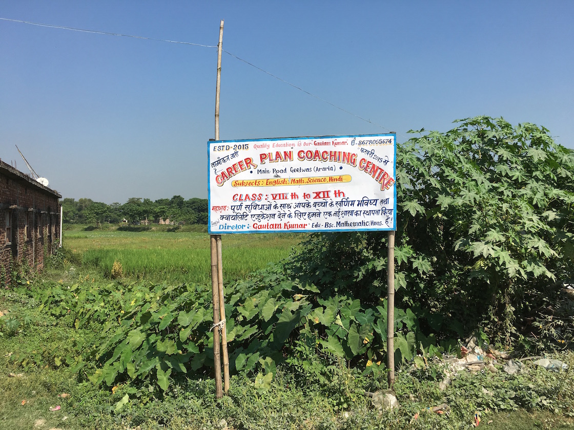 The board on a road passing through Geetwas village advertises the services of Career Plan Coaching Centre. The board on a road passing through Geetwas village advertises the services of Career Plan Coaching Centre.