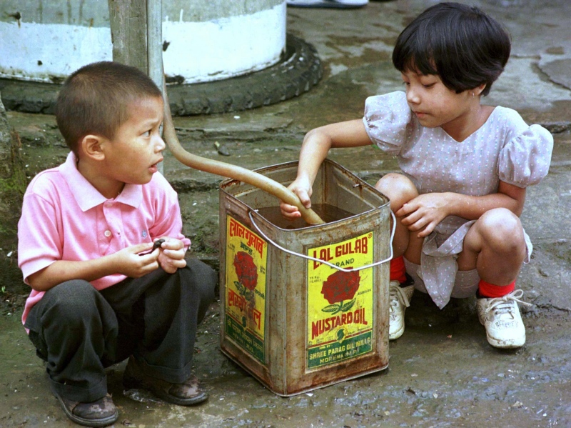 Children fill a canister with drinking water from a public tap in Aizawl, Mizoram, which suffers from an acute water scarcity. (Photo credit: Reuters). Children fill a canister with drinking water from a public tap in Aizawl, Mizoram, which suffers from an acute water scarcity. (Photo credit: Reuters).
