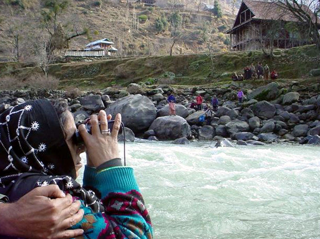 People travelled to the Line of Control to speak with their relatives across the Neelam river. Image credit: Reuters People travelled to the Line of Control to speak with their relatives across the Neelam river. Image credit: Reuters