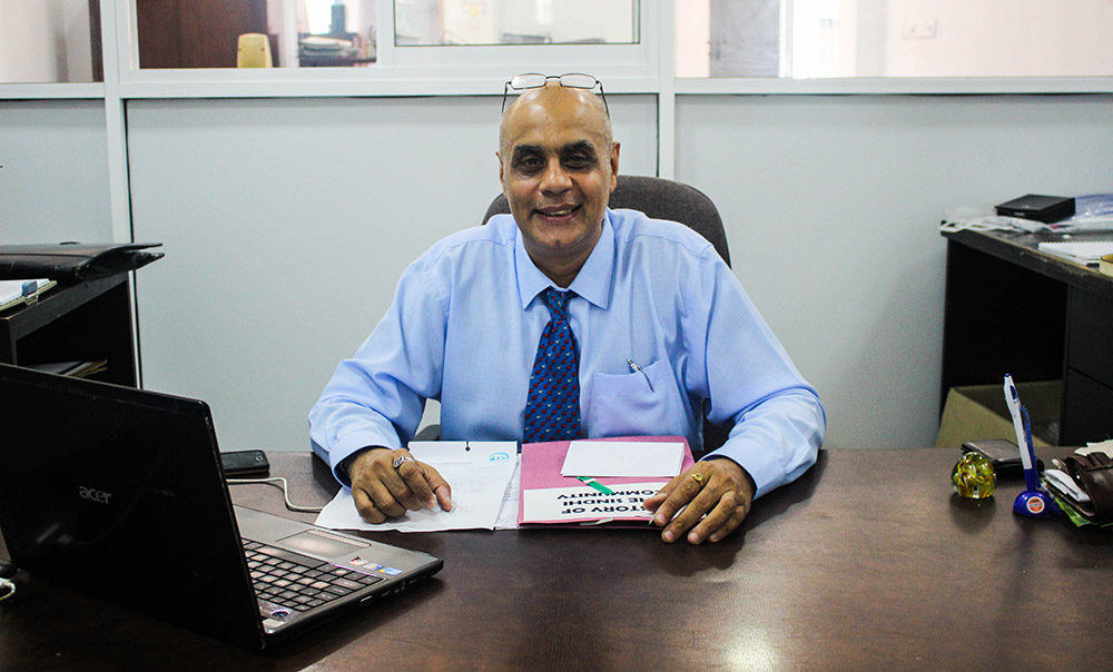 SASL secretary, Sunil Shamdasani, at his desk. Photo credit: Aisha Nazim SASL secretary, Sunil Shamdasani, at his desk. Photo credit: Aisha Nazim