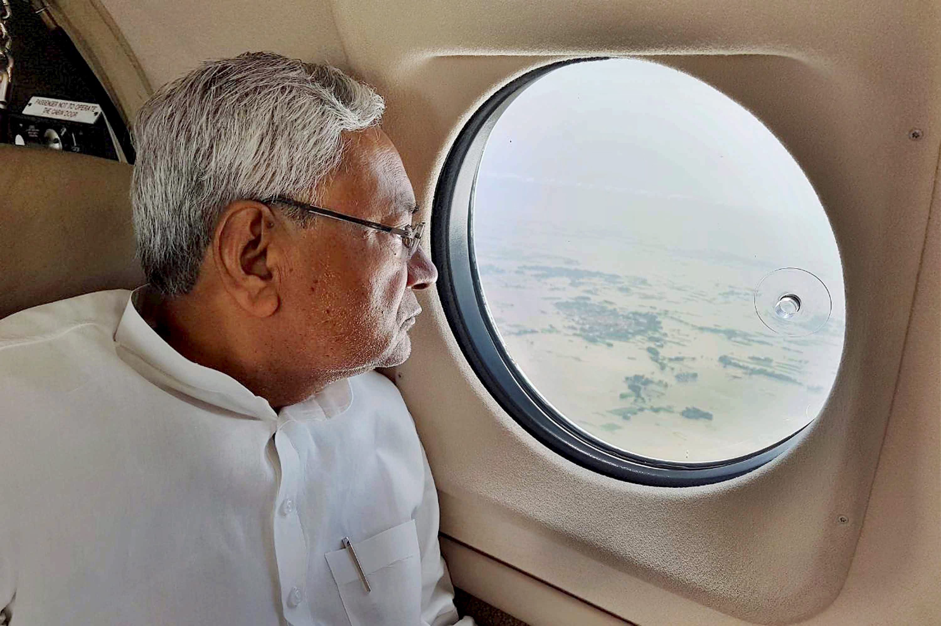 Chief Minister Nitish Kumar takes an aerial survey of flood-affected regions in Bihar. (Credit: PTI) Chief Minister Nitish Kumar takes an aerial survey of flood-affected regions in Bihar. (Credit: PTI)
