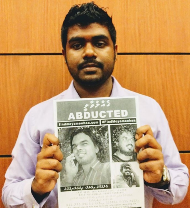 Rasheed with a poster of his friend, Ahmed Rilwan, who was abducted in 2014 . (Photo courtesy: Yameen Rasheed/Facebook). Rasheed with a poster of his friend, Ahmed Rilwan, who was abducted in 2014 . (Photo courtesy: Yameen Rasheed/Facebook).