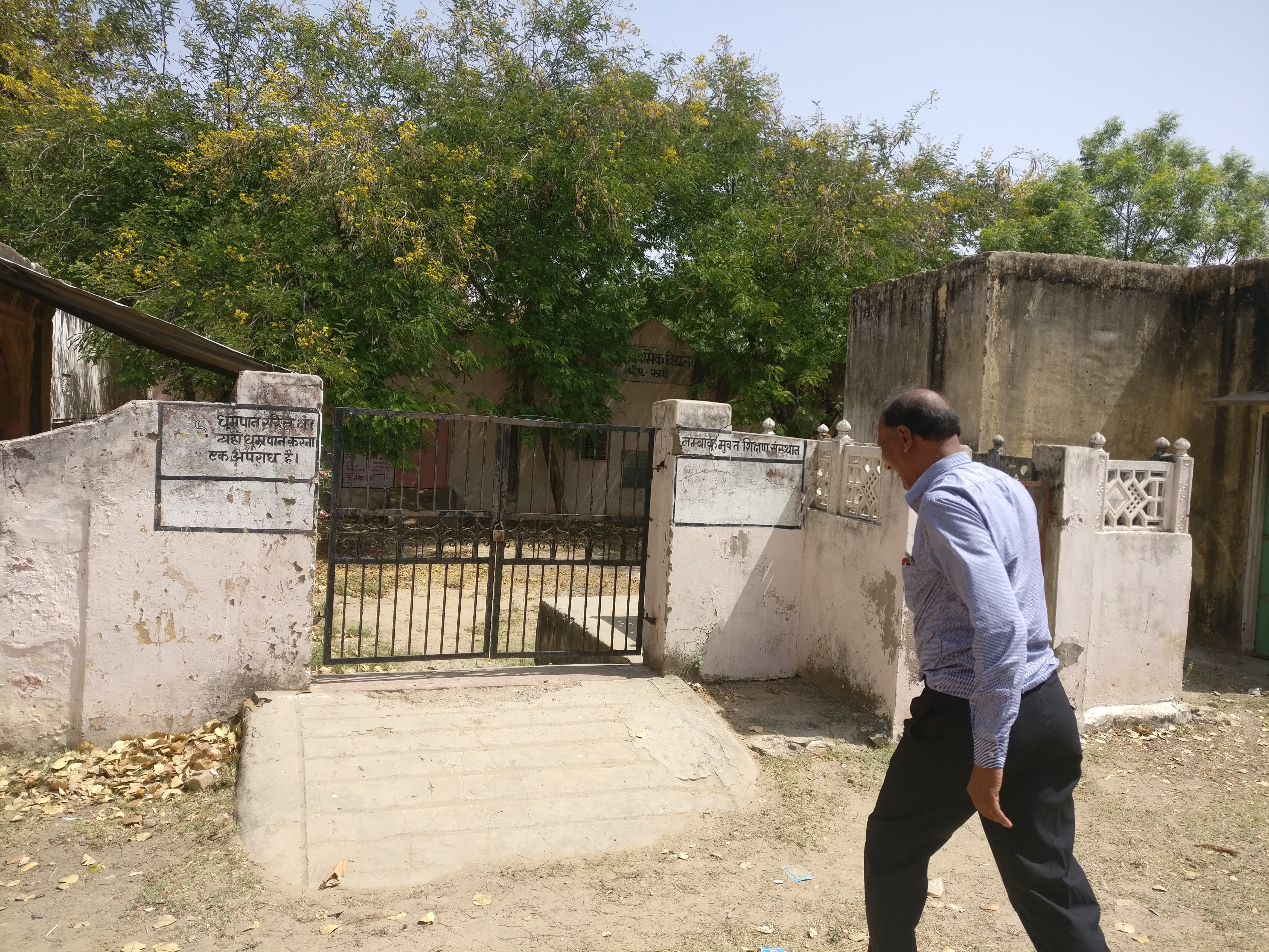 Teacher Ramswarup Jahangir walks to the now abandoned primary school in Pipla. Teacher Ramswarup Jahangir walks to the now abandoned primary school in Pipla.