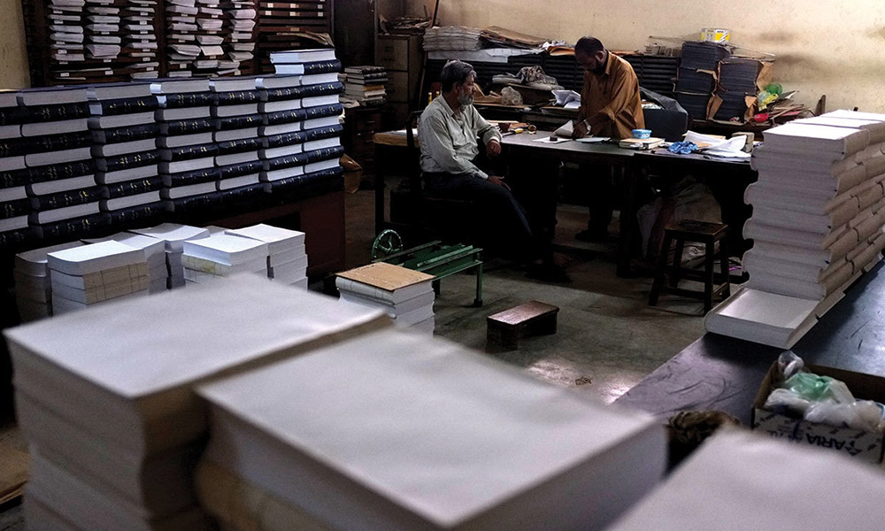 Workers bind dictionaries at the Urdu Dictionary Board in Karachi . Photo credit: Arif Mahmood/White Star Workers bind dictionaries at the Urdu Dictionary Board in Karachi . Photo credit: Arif Mahmood/White Star