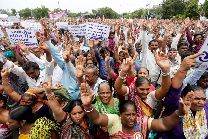 People shout slogans at the Dalit rally in Ahmedabad on Sunday. (Photo credit: Amit Dave/Reuters) People shout slogans at the Dalit rally in Ahmedabad on Sunday. (Photo credit: Amit Dave/Reuters)