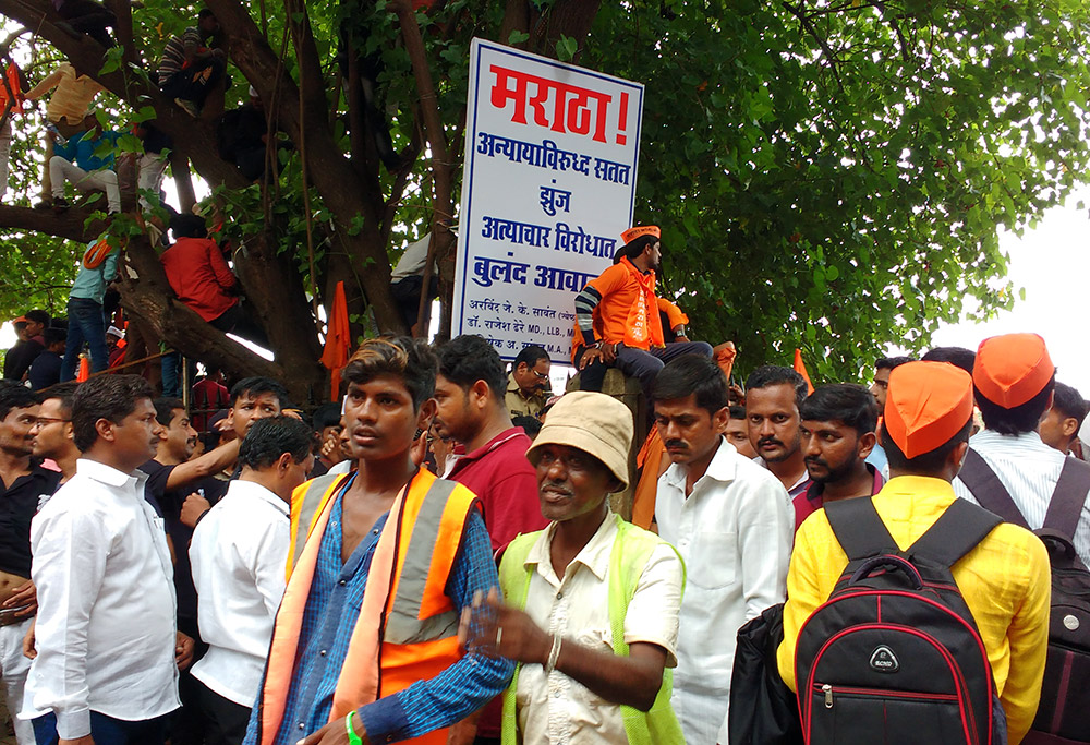 A banner reminds Marathas to continue to fight against injustice. Photo: Mridula Chari A banner reminds Marathas to continue to fight against injustice. Photo: Mridula Chari