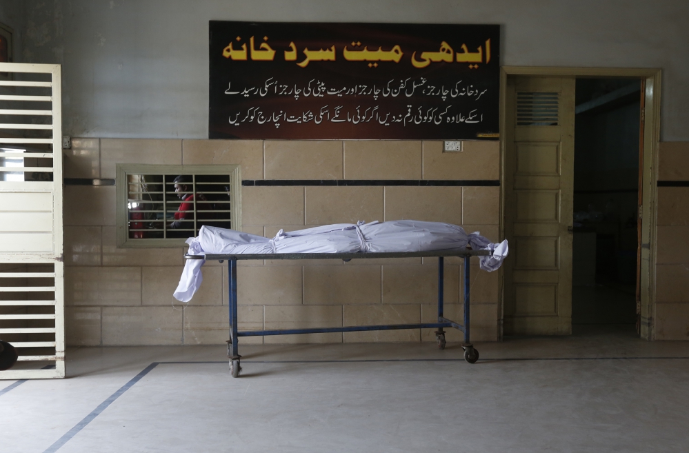 A body at the Edhi Foundation morgue, waiting to be collected by relatives. (Photo: Akthar Soomro/Reuters) A body at the Edhi Foundation morgue, waiting to be collected by relatives. (Photo: Akthar Soomro/Reuters)