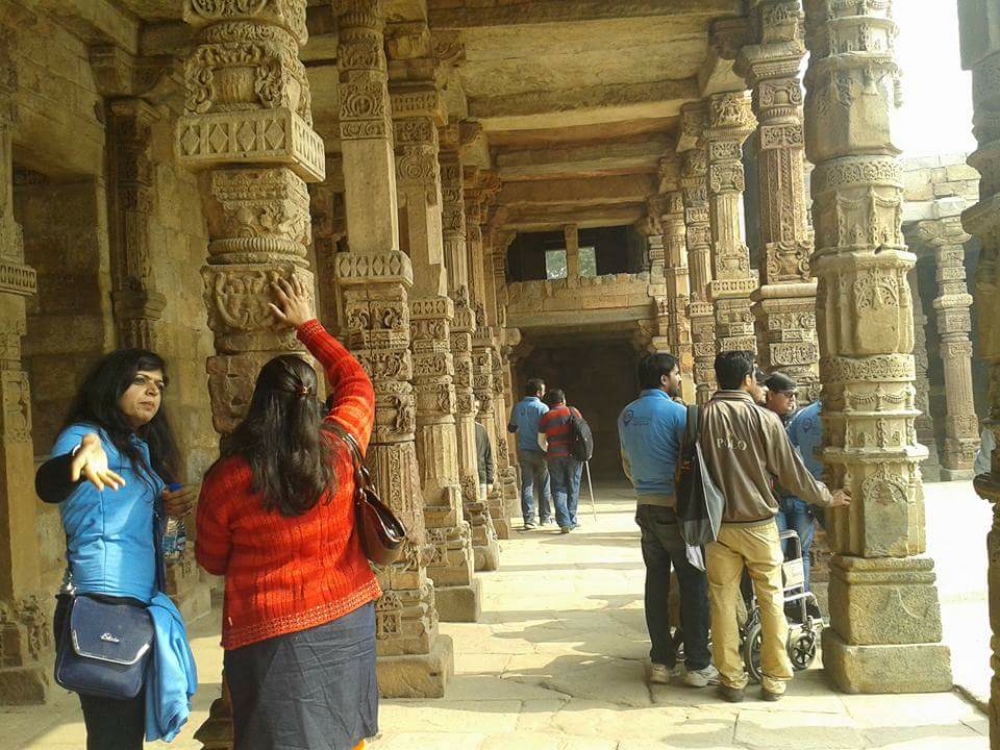 During the Qutub Minar excursion, visually impaired participants get a sense of the complex by touching the carvings and inscriptions. (Photo courtesy: Planet Abled) During the Qutub Minar excursion, visually impaired participants get a sense of the complex by touching the carvings and inscriptions. (Photo courtesy: Planet Abled)