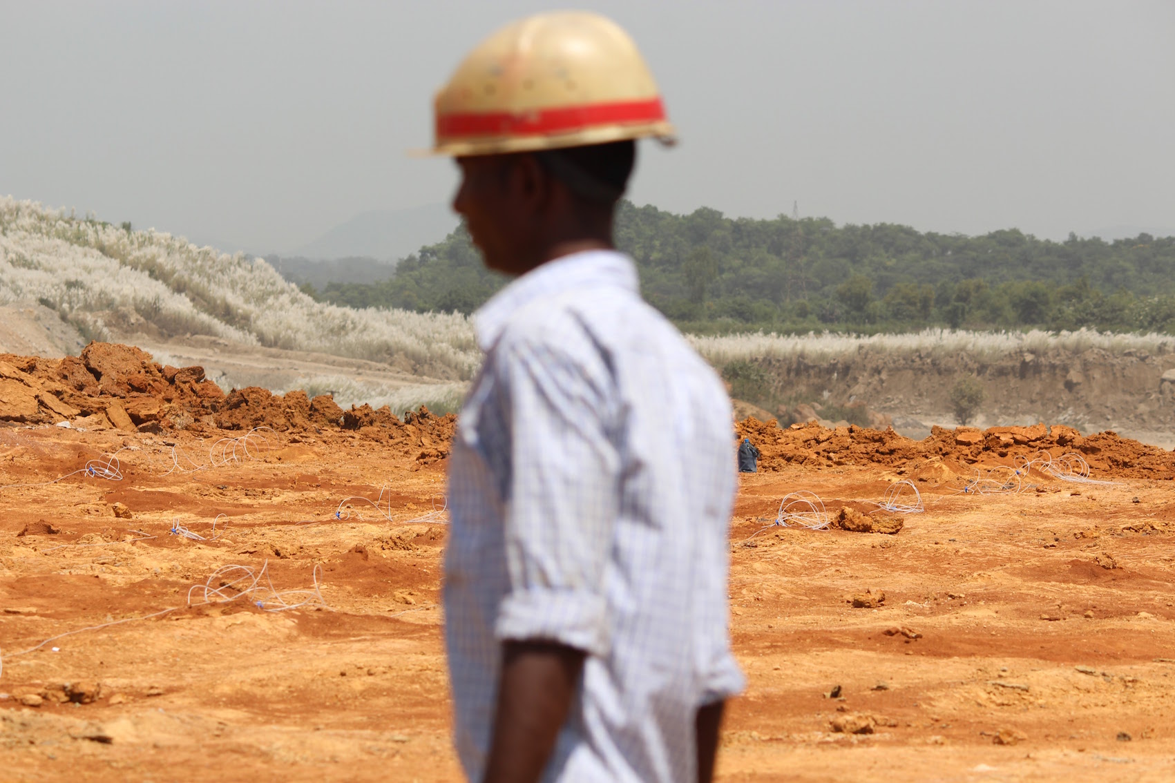 A miner places dynamite sticks in what was the village of Barkuta in Korba, Chhattisgarh. Barkuta stood on the edge of Kusmunda, one of India's largest coal mines. September 2015. Photo credit: Aruna Chandrasekhar. A miner places dynamite sticks in what was the village of Barkuta in Korba, Chhattisgarh. Barkuta stood on the edge of Kusmunda, one of India's largest coal mines. September 2015. Photo credit: Aruna Chandrasekhar.