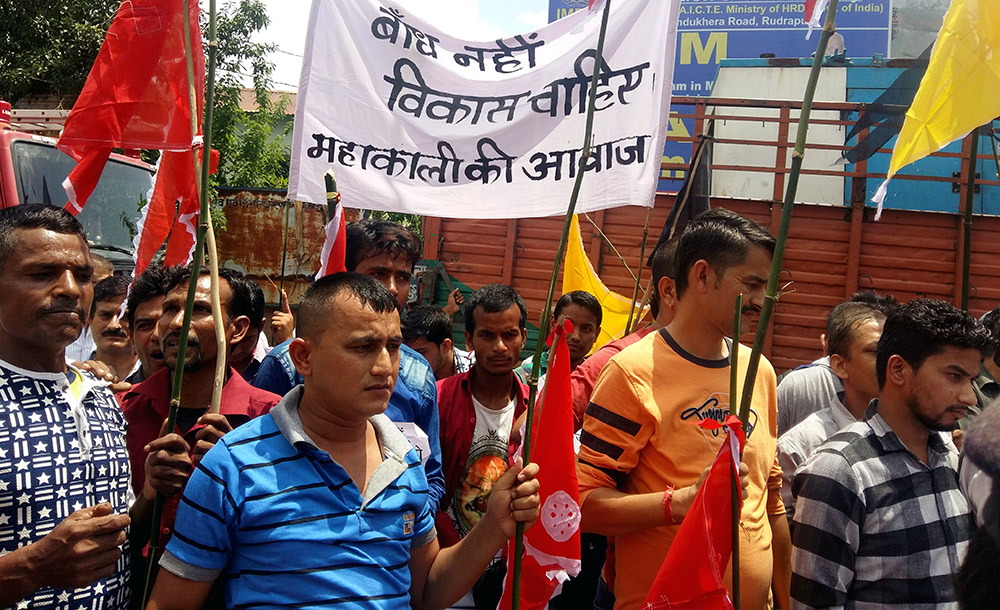 Pithoragarh residents protest outside the venue of a public hearing on the dam project on August 11. Photo credit: Hridayesh Joshi Pithoragarh residents protest outside the venue of a public hearing on the dam project on August 11. Photo credit: Hridayesh Joshi