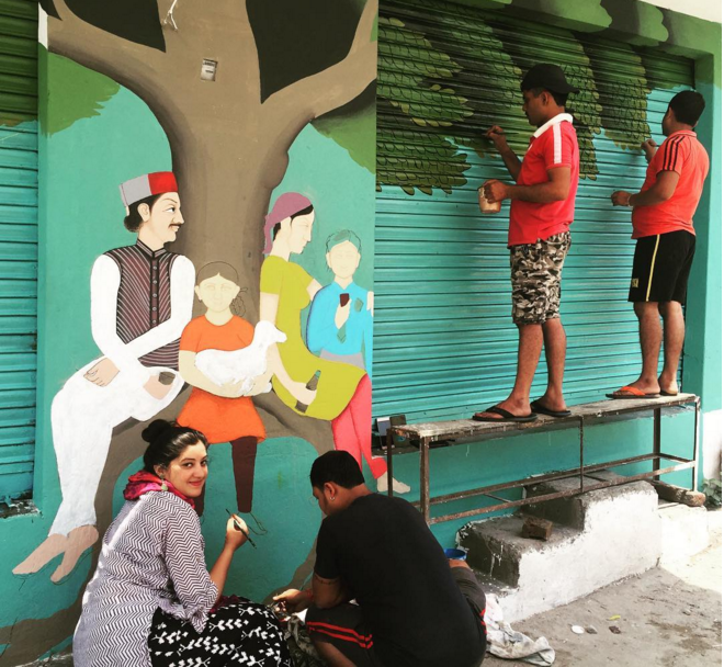 Delhi-based illustrator Gargi Chandola and her team hard at work at the Gunehar village square. (Photo credit: shopartartshop/Instagram.) Delhi-based illustrator Gargi Chandola and her team hard at work at the Gunehar village square. (Photo credit: shopartartshop/Instagram.)