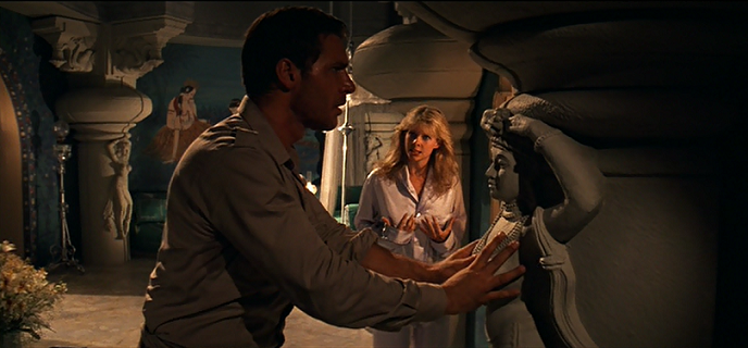 Indiana Jones (Harrison Ford) finds the secret passage. Indiana Jones (Harrison Ford) finds the secret passage.
