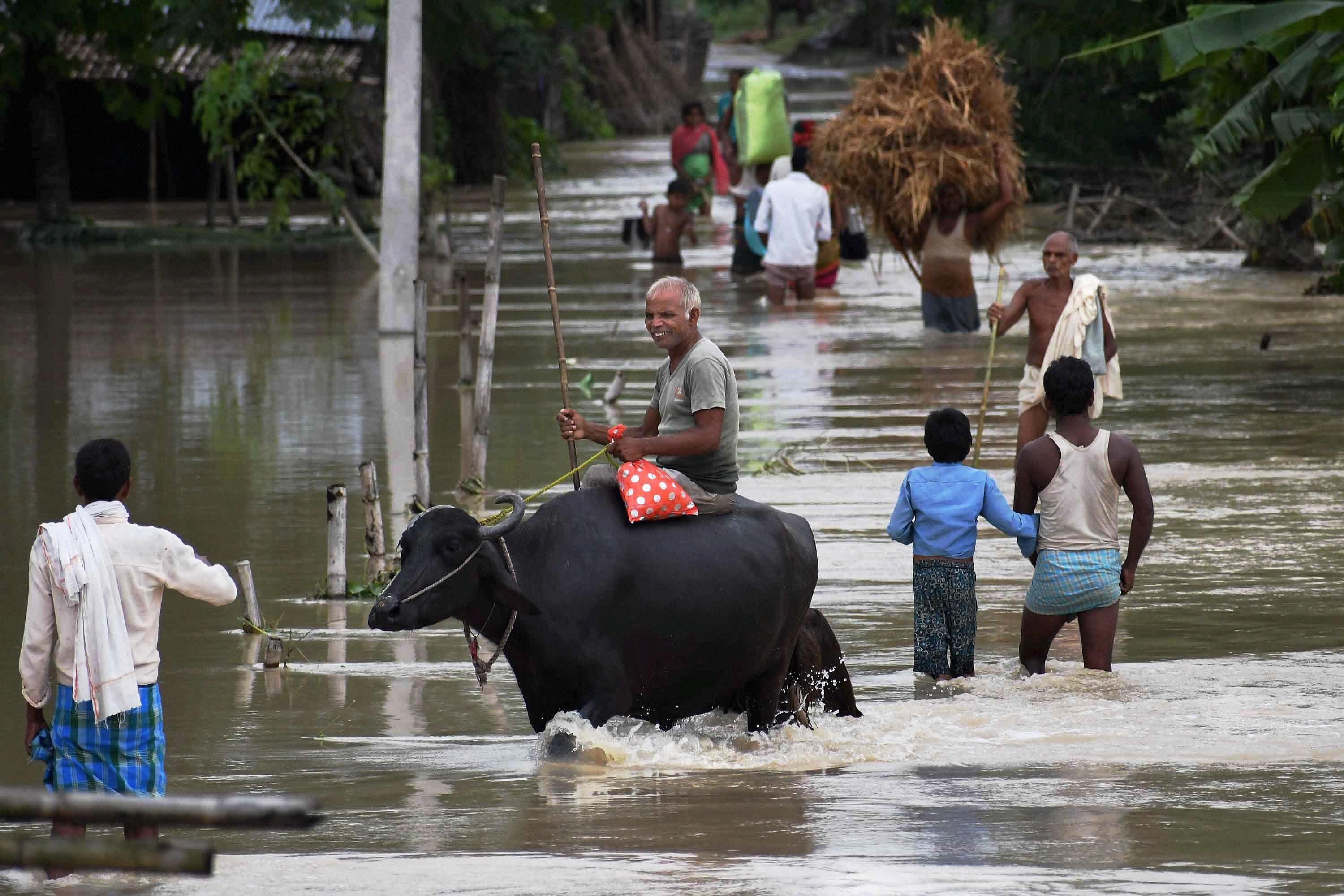 Villagers in the flood-hit Araria district in Bihar. (Credit: PTI) Villagers in the flood-hit Araria district in Bihar. (Credit: PTI)