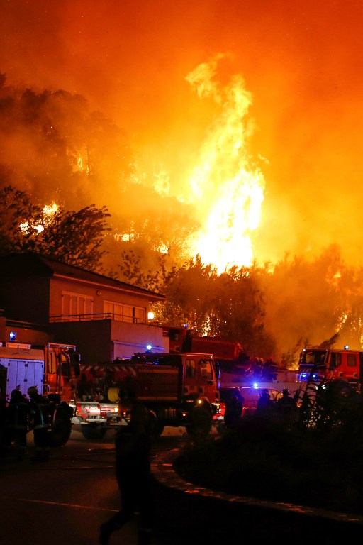 Firefighters battle the blaze in Biguglia. (Credit: Pascal Pochard-Casabianca/AFP) Firefighters battle the blaze in Biguglia. (Credit: Pascal Pochard-Casabianca/AFP)