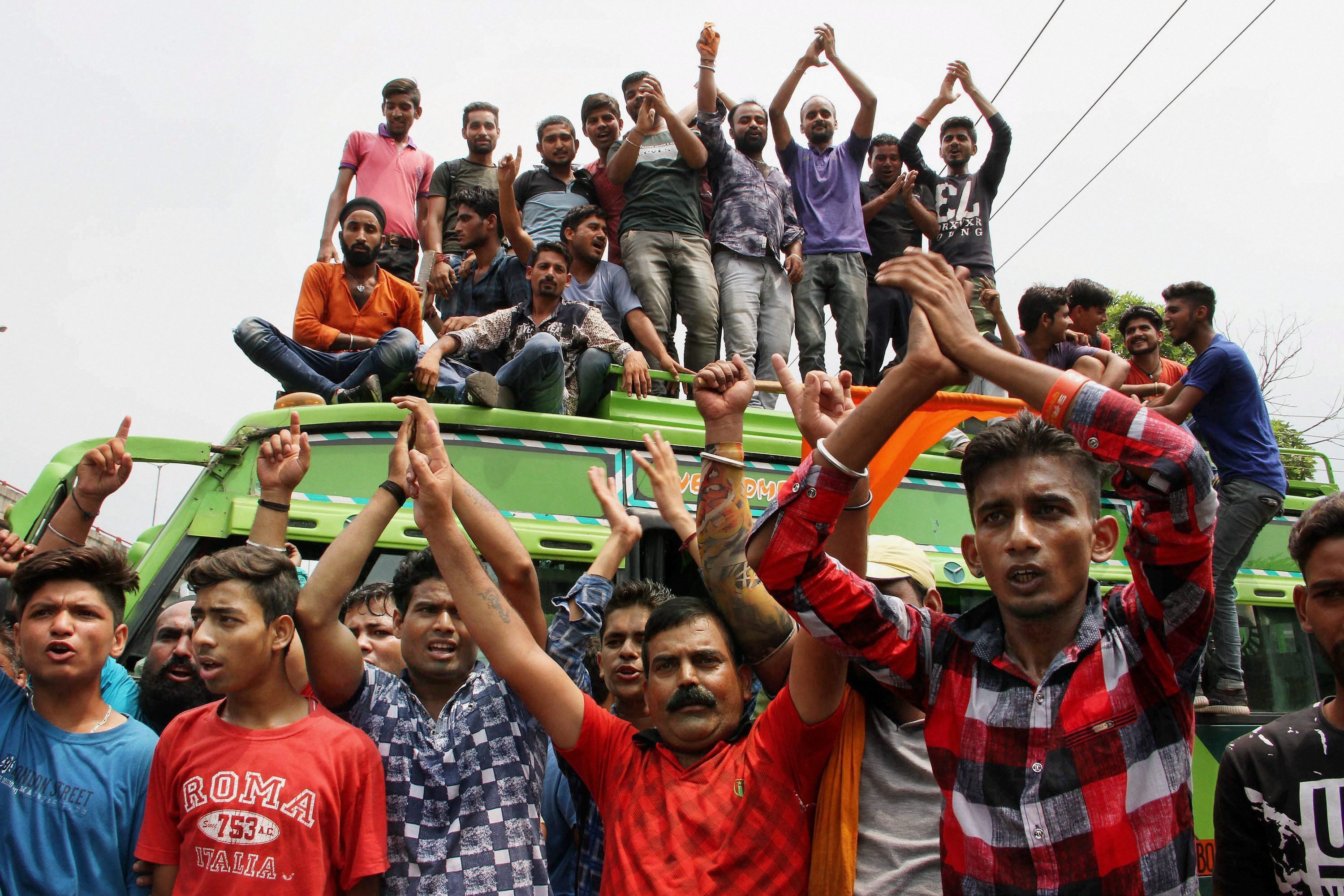 Protestors should slogans during a strike in Jammu. (Credit: PTI) Protestors should slogans during a strike in Jammu. (Credit: PTI)