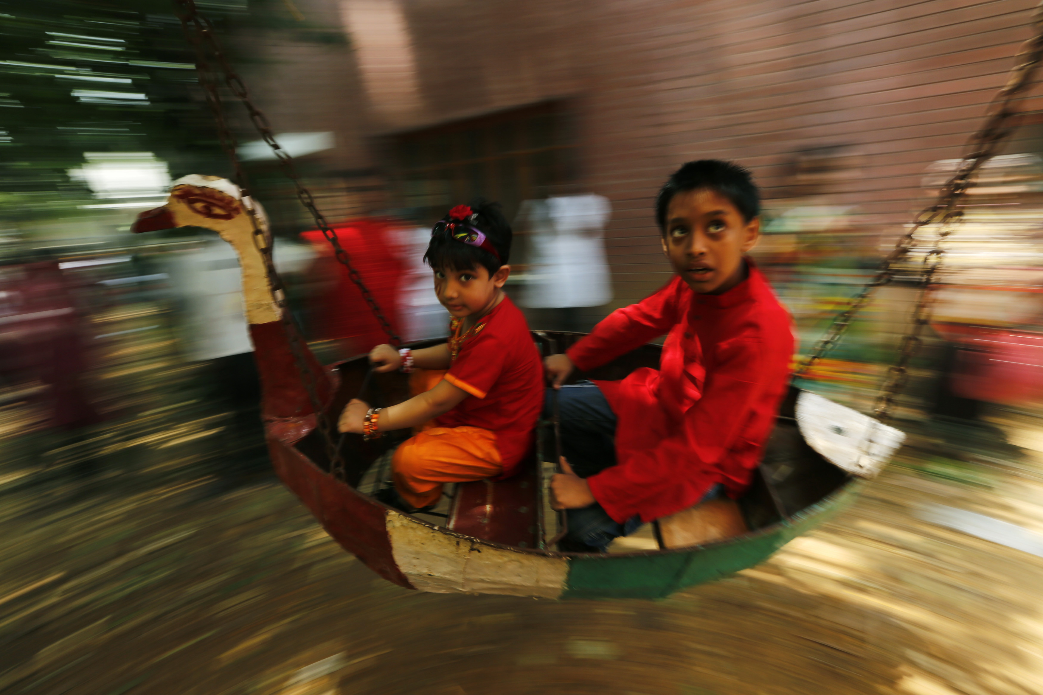 Children at play during the Mongol Shobhajatra in Dhaka. Photo credit: REUTERS/Andrew Biraj Children at play during the Mongol Shobhajatra in Dhaka. Photo credit: REUTERS/Andrew Biraj