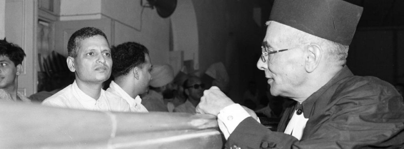 Nathuram Godse with Vinayak Savarkar during the trial for the assassination of Gandhi. Nathuram Godse with Vinayak Savarkar during the trial for the assassination of Gandhi.