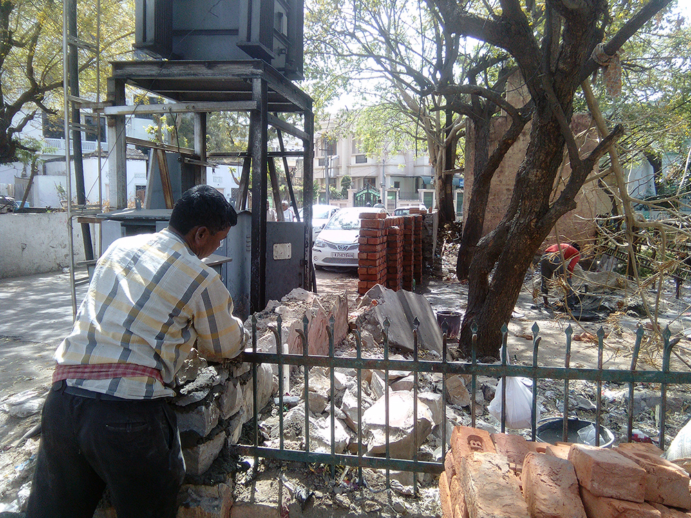A wall being built around the temporary garbage dump. (Photo credit: Abhishek Dey). A wall being built around the temporary garbage dump. (Photo credit: Abhishek Dey).