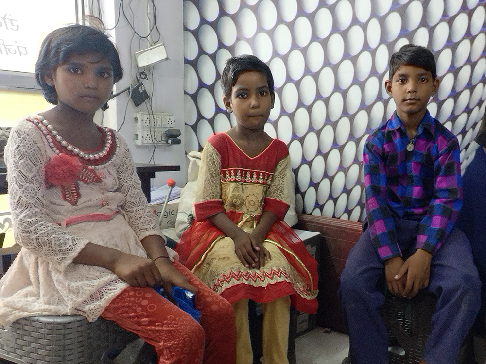 Hemalata, Nisha and Jai, all Class 4 students from Lakhanpur, wait to be enrolled at a Badaun Aadhaar registration centre. Photo credit: Shreya Roy Chowdhury Hemalata, Nisha and Jai, all Class 4 students from Lakhanpur, wait to be enrolled at a Badaun Aadhaar registration centre. Photo credit: Shreya Roy Chowdhury
