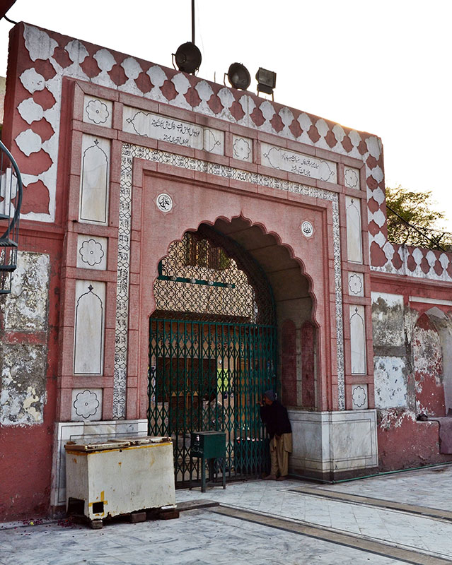 Like a lot of Islamic architecture, the shrine's gate bears Persian inscriptions. — Photo by Abdullah Khan. Like a lot of Islamic architecture, the shrine's gate bears Persian inscriptions. — Photo by Abdullah Khan.