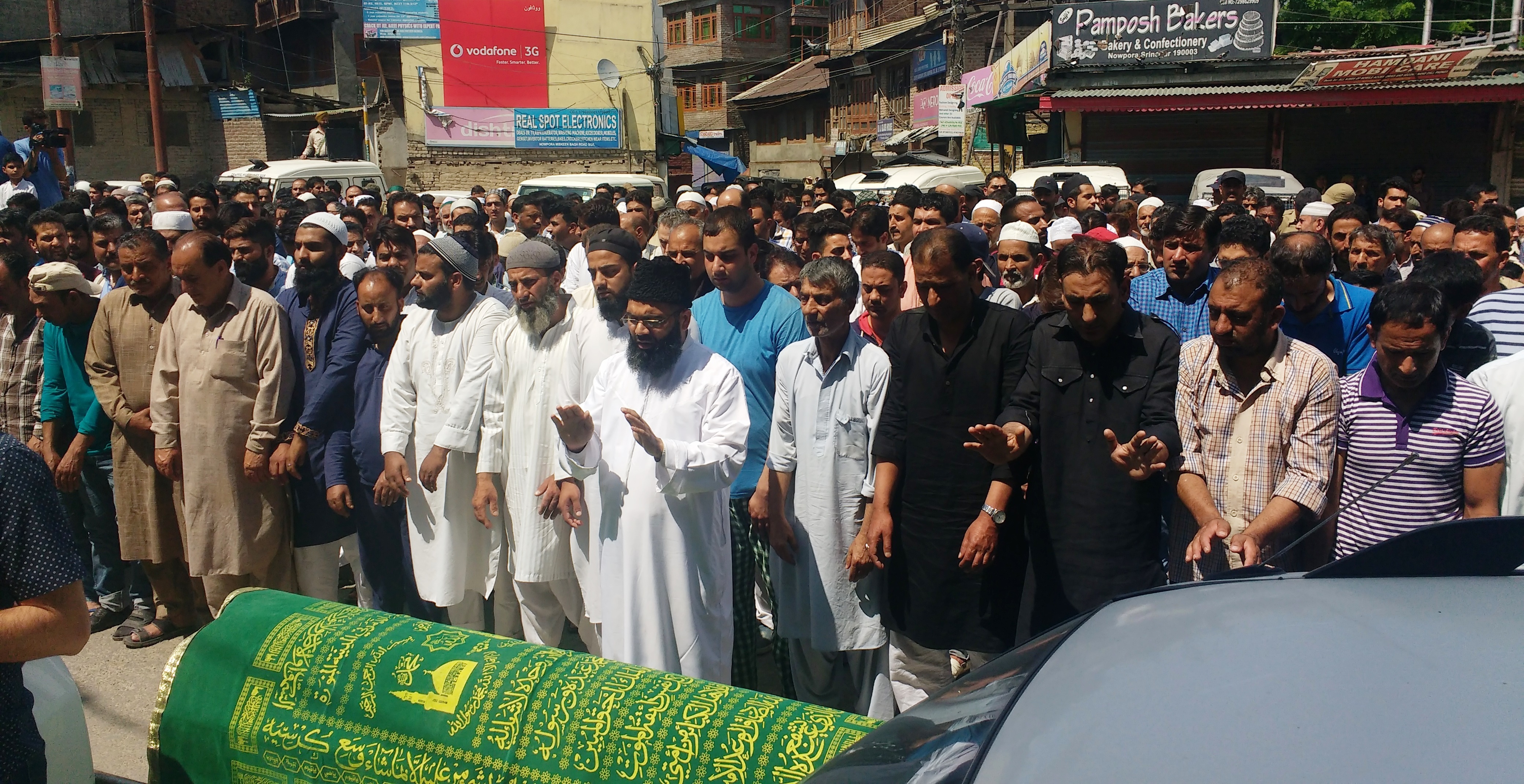 Relatives and neighbours pray over Mohammed Pandith's body. Credit: Rayan Naqash Relatives and neighbours pray over Mohammed Pandith's body. Credit: Rayan Naqash
