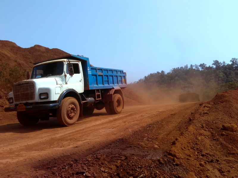 Trucks at the mine site. (Photo credit: Pamela D’Mello). Trucks at the mine site. (Photo credit: Pamela D’Mello).