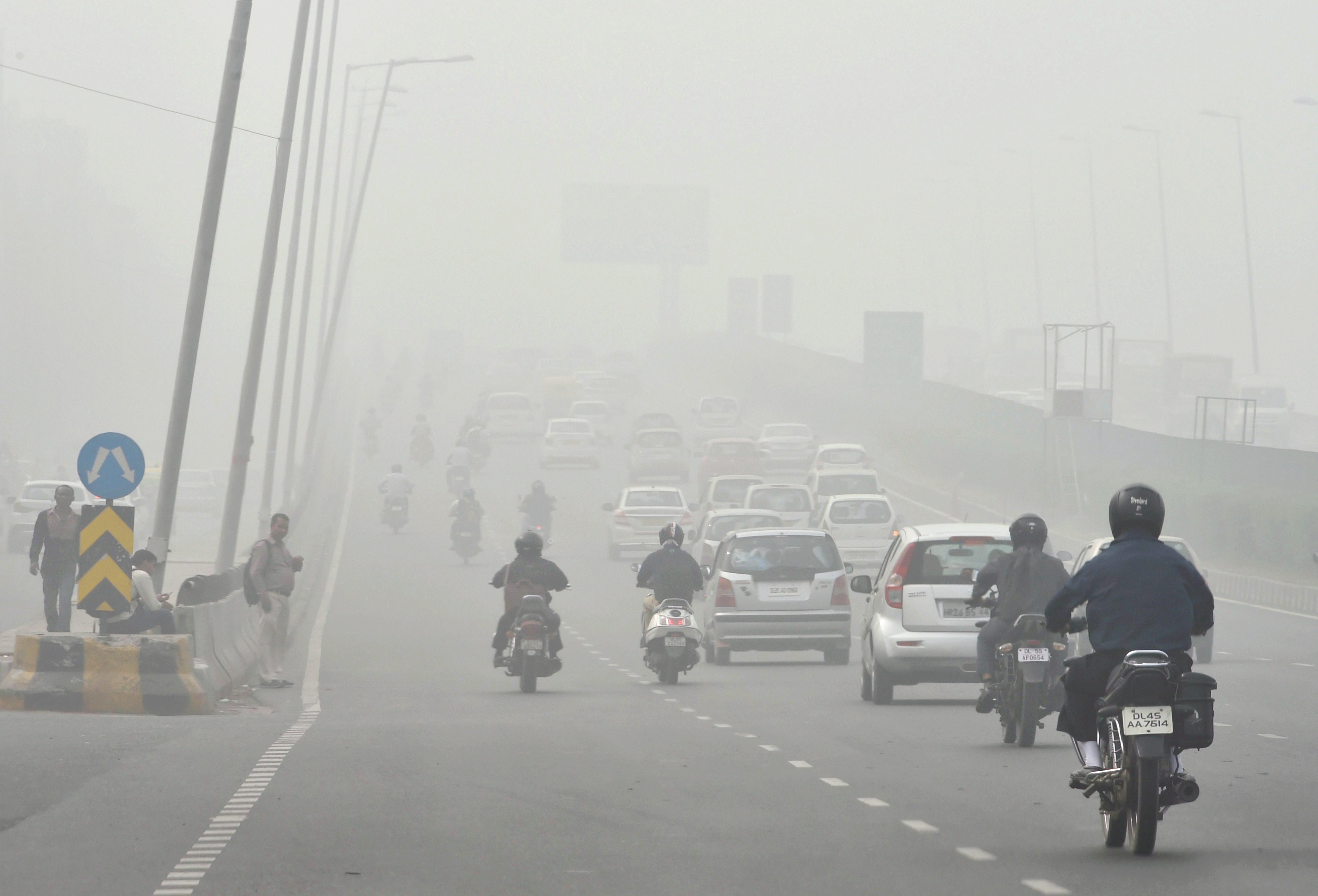 Low visibility, caused by increased pollution levels, hindered Delhi commuters on Tuesday (PTI) Low visibility, caused by increased pollution levels, hindered Delhi commuters on Tuesday (PTI)