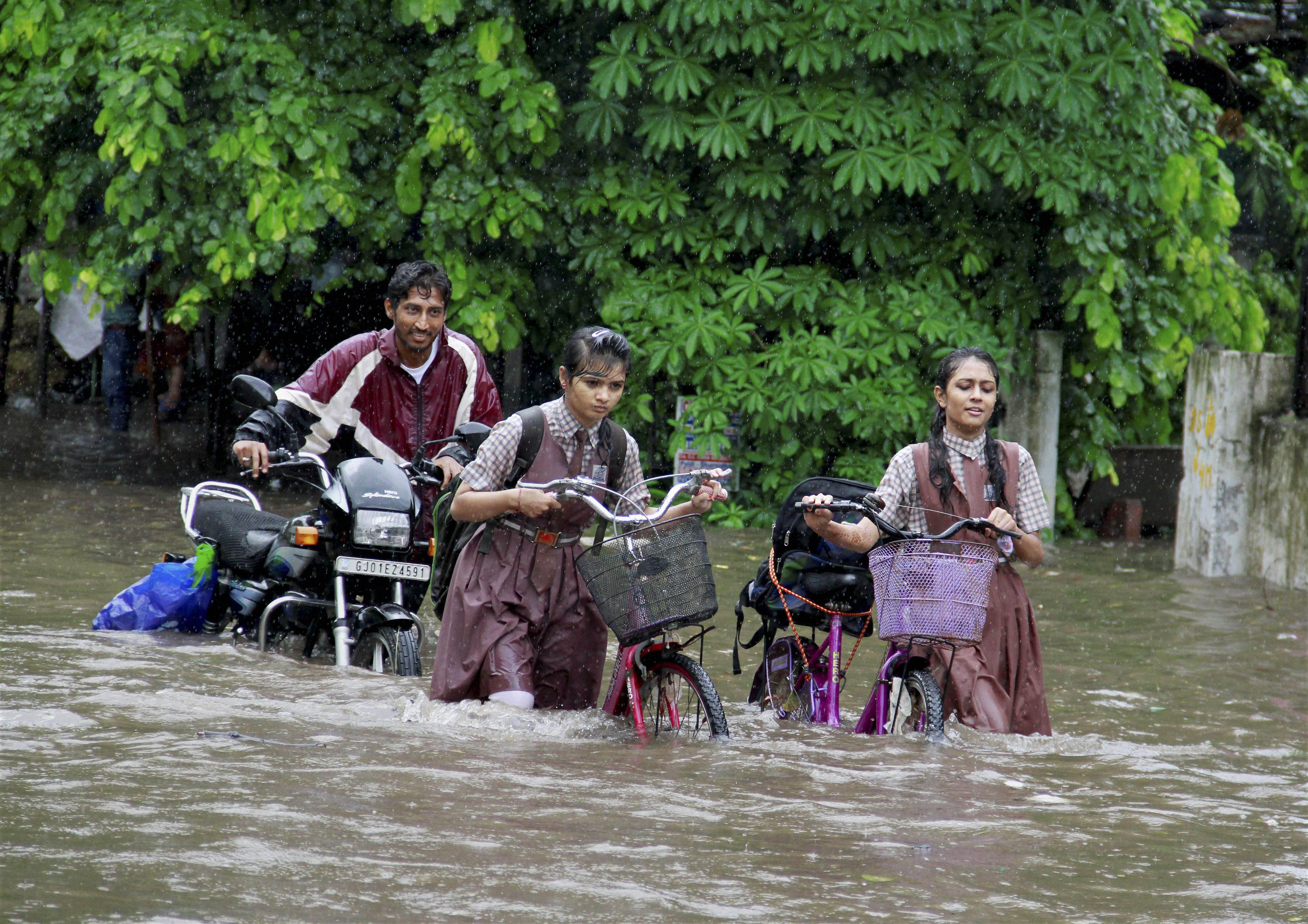 Schools will be closed in Ahmedabad on Monday because of heavy rain and flooding. (Credit: PTI) Schools will be closed in Ahmedabad on Monday because of heavy rain and flooding. (Credit: PTI)