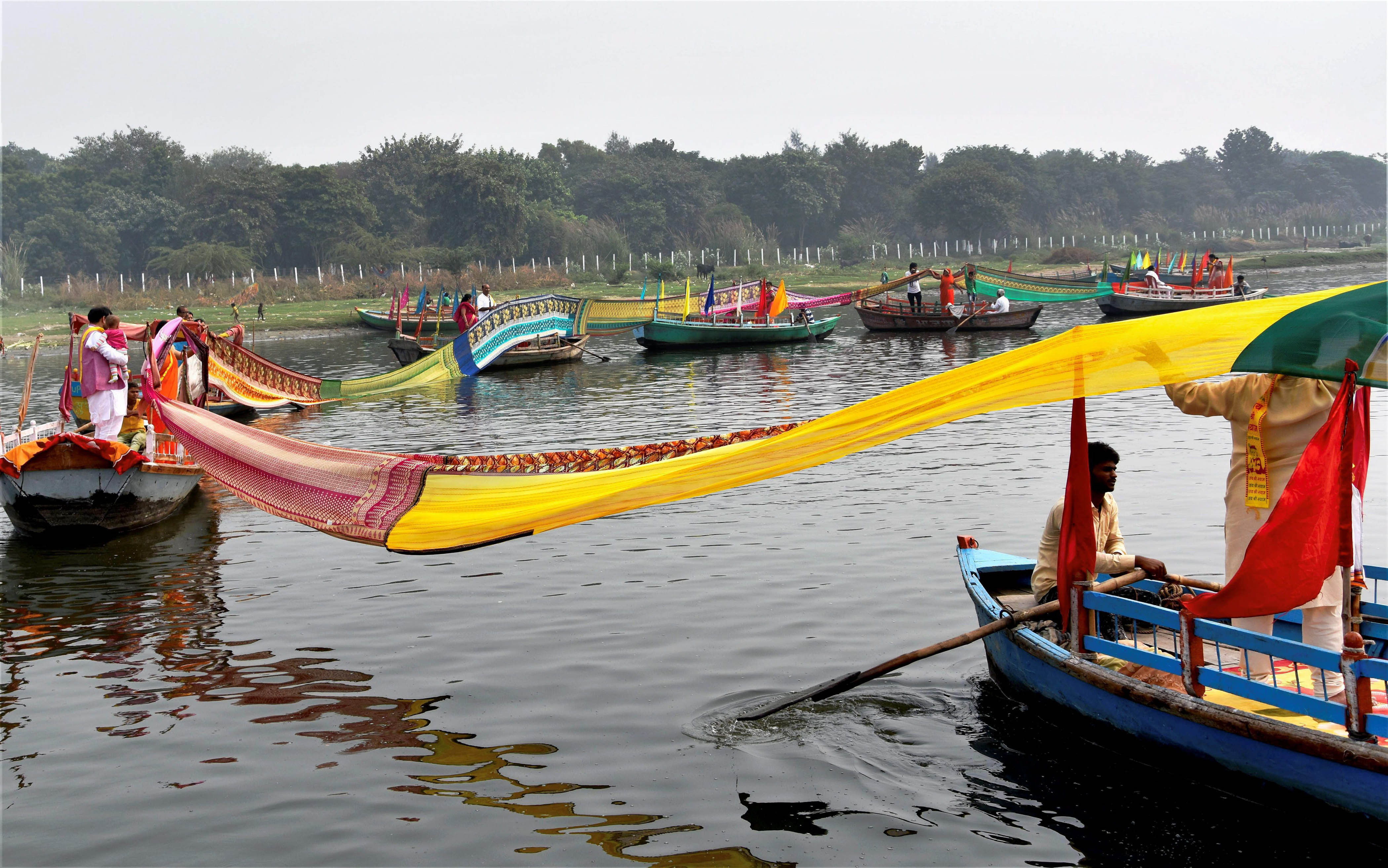 People celebrate "Chunari Manorath" in the Yamuna in Mathura. (Credit: PTI) People celebrate "Chunari Manorath" in the Yamuna in Mathura. (Credit: PTI)