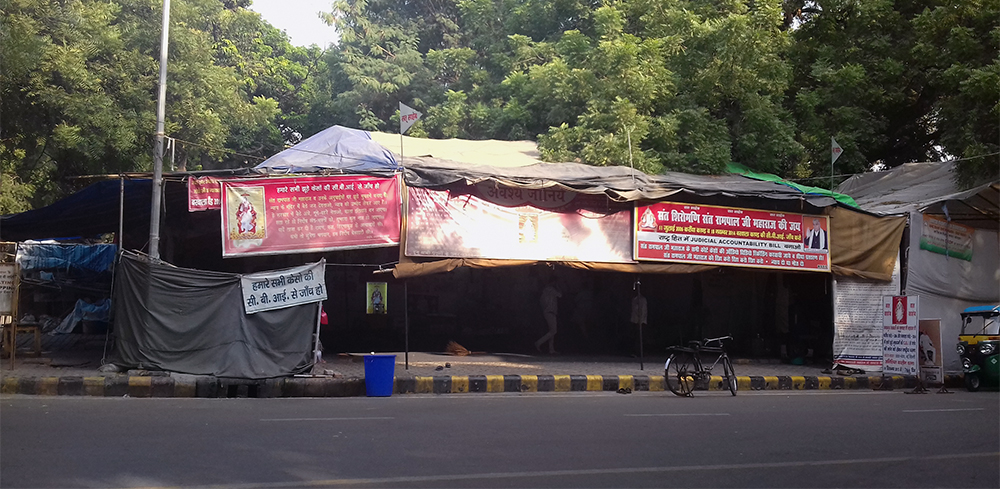 Some protestors remain at Jantar Mantar after the National Green Tribunal's ban order, though their numbers have dwindled. Some protestors remain at Jantar Mantar after the National Green Tribunal's ban order, though their numbers have dwindled.