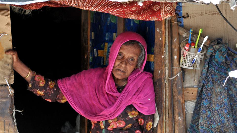 A Rohingya woman stands at the entrance of her temporary home at a refugee camp in Jammu. (Photo credit: HT). A Rohingya woman stands at the entrance of her temporary home at a refugee camp in Jammu. (Photo credit: HT).
