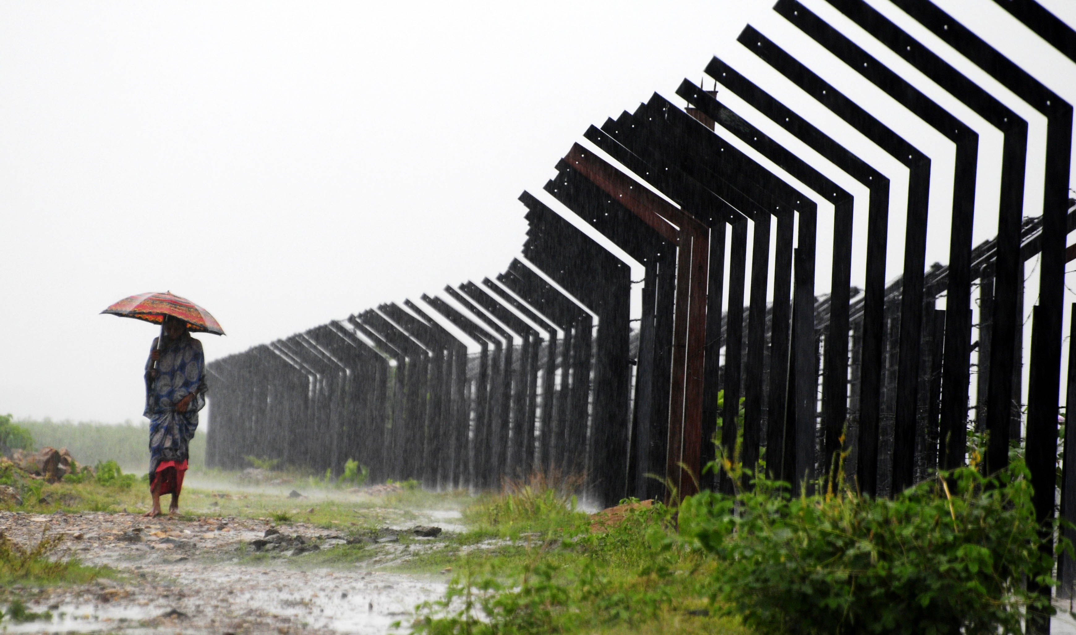 A section of the Indo-Bangladesh border. A section of the Indo-Bangladesh border.