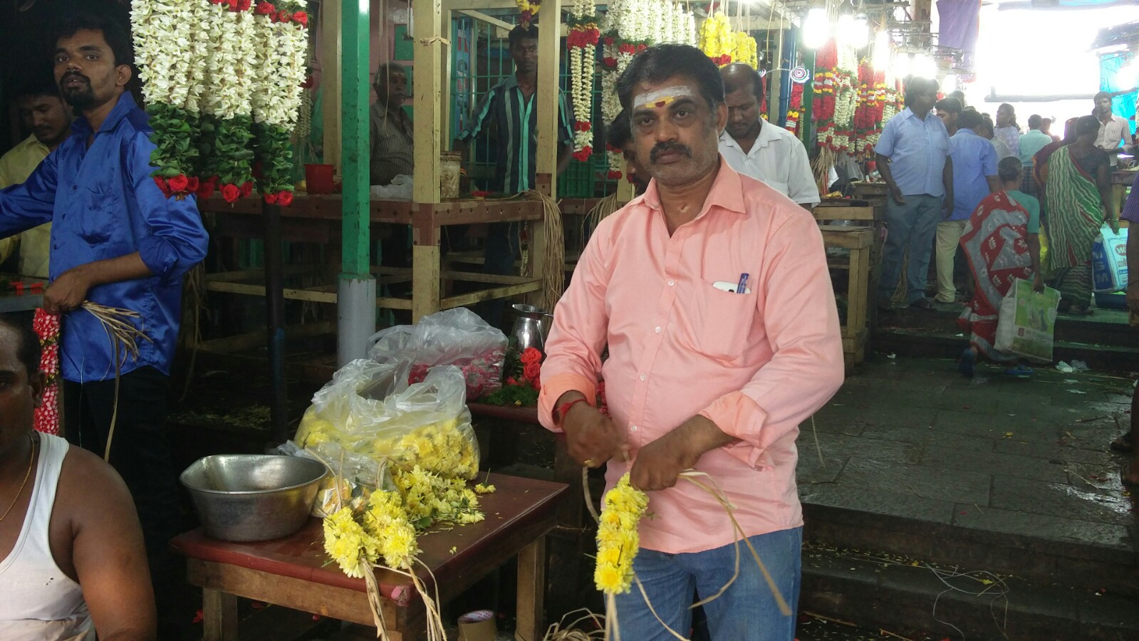 S Ravichandran outside his garland shop. Credit: Vinita Govindarajan S Ravichandran outside his garland shop. Credit: Vinita Govindarajan
