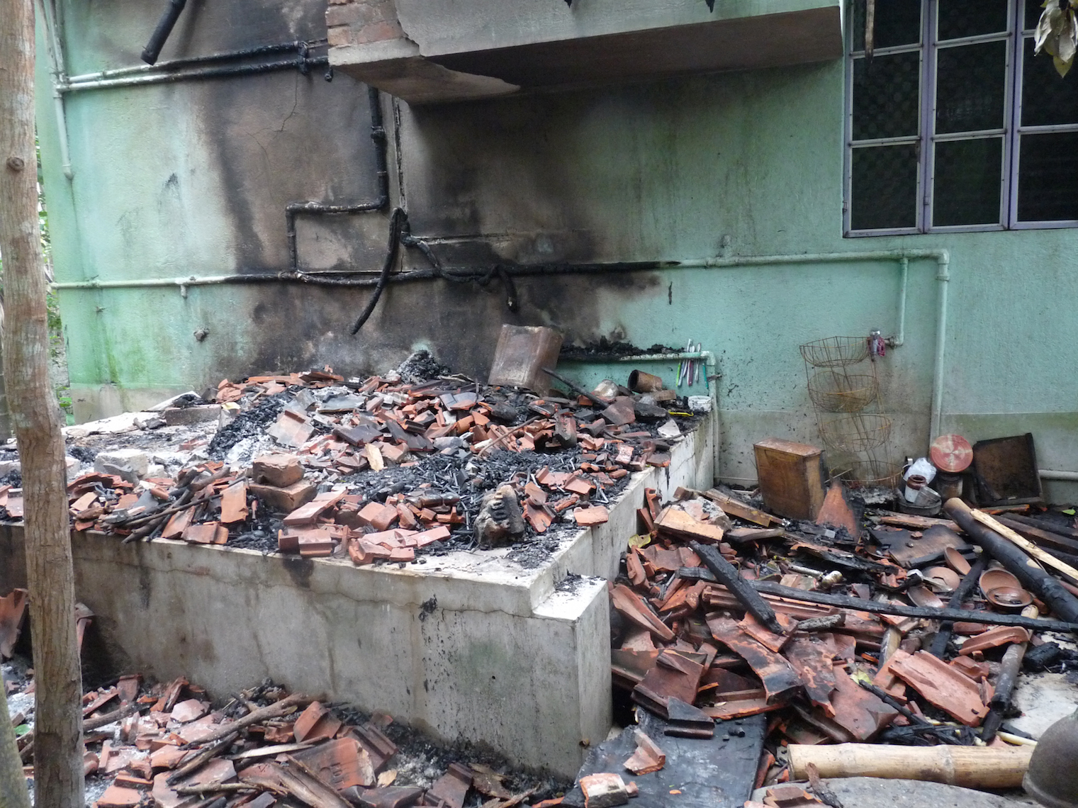 As is visible from the backyard, protestors damaged the house in which the student lived with his uncle. Photo credit: Subrata Nag Choudhury As is visible from the backyard, protestors damaged the house in which the student lived with his uncle. Photo credit: Subrata Nag Choudhury