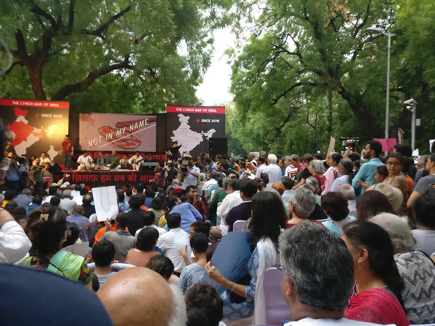 People watch a folk music show organised at the People watch a folk music show organised at the