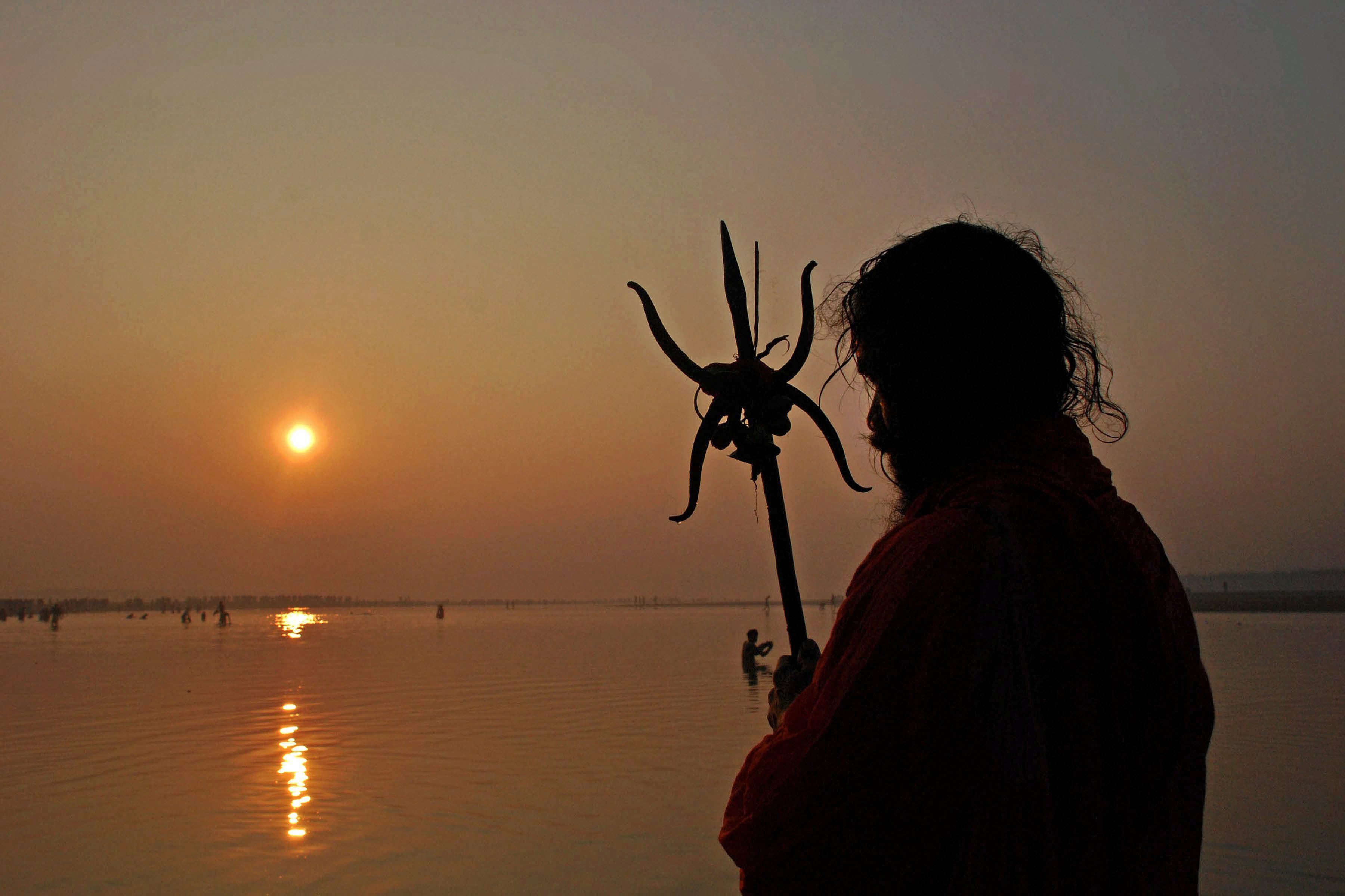 A Sadhu offer prayers after taking a holy dip in Ajay river on the occasion of Kartik Purnima in West Bengal's Birbhum district. (Credit: PTI) A Sadhu offer prayers after taking a holy dip in Ajay river on the occasion of Kartik Purnima in West Bengal's Birbhum district. (Credit: PTI)