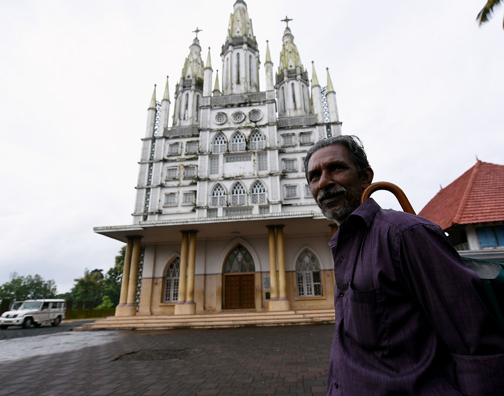 A devotee in front of St Peter's Church in Kolenchery. A devotee in front of St Peter's Church in Kolenchery.