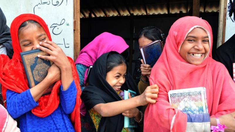 Rohingya girls react to the camera as they wait for their teacher outside their Madrasa at a refugee camp in Jammu. (Photo credit: HT) Rohingya girls react to the camera as they wait for their teacher outside their Madrasa at a refugee camp in Jammu. (Photo credit: HT)