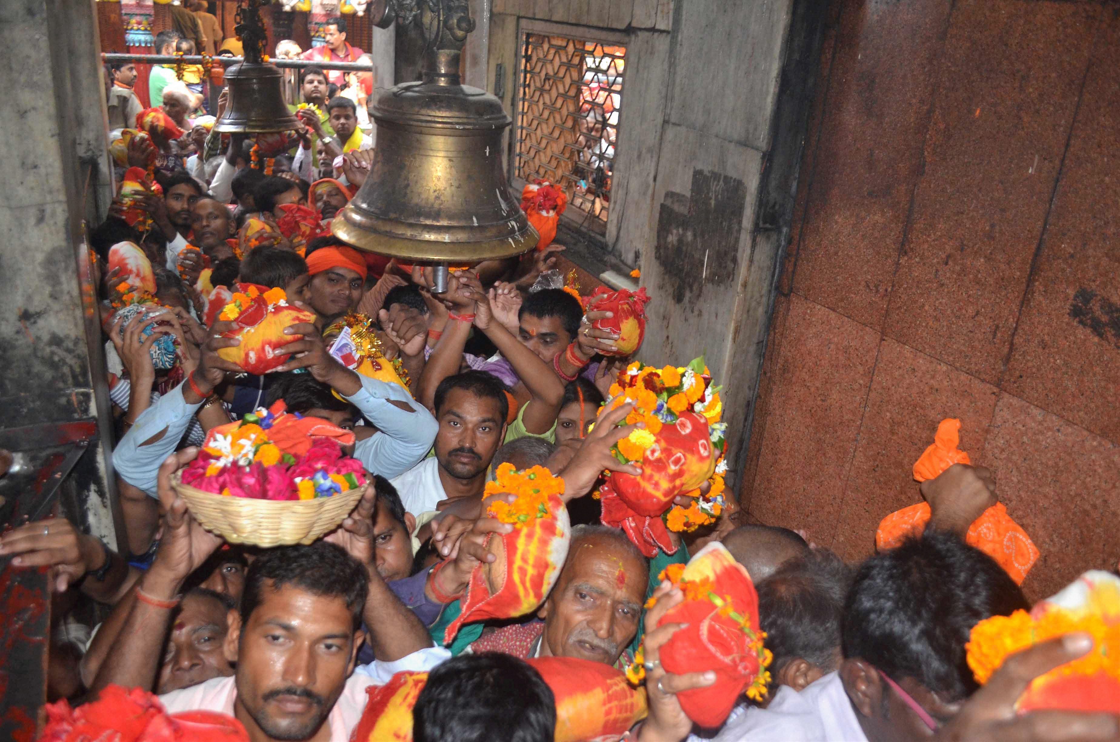 Devotees wait in a queue at the Vindhyavasini temple in Mirzapur, Uttar Pradesh, on Kartik Purnima. (Credit: PTI) Devotees wait in a queue at the Vindhyavasini temple in Mirzapur, Uttar Pradesh, on Kartik Purnima. (Credit: PTI)